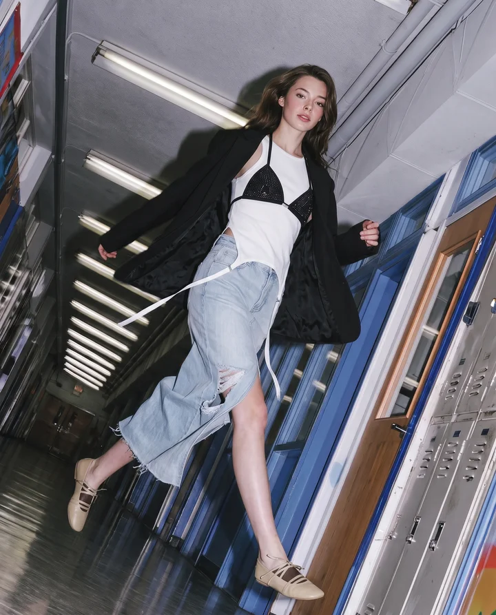 a_high-fashion_model_striding_down_a_school_hallway_like_a_ru_48b5650b-8dcc-4ba0-95b5-bd33623014e4_0