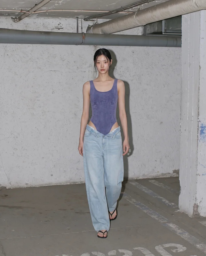 a_high-fashion_model_standing_casually_inside_a_modernist_und_700464f0-3eb6-466b-bbdd-838d461ea9ce_1