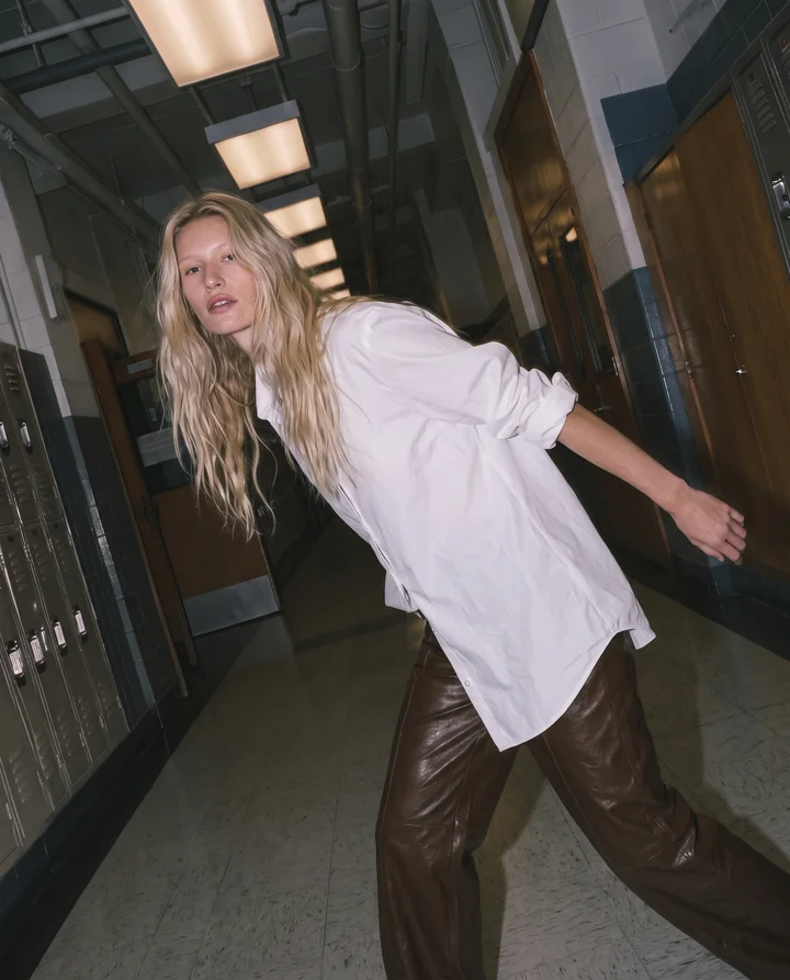 a_high-fashion_model_striding_down_a_school_hallway_like_a_ru_582db440-b2d6-42bb-a77f-0a3ba50f73a9_0